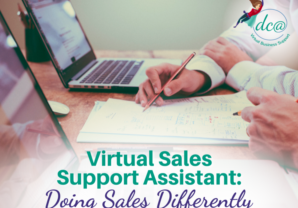 Virtual Sales Support Assistant Doing Sales Differently. Image of two people looking at paperwork while holding pencils. Two open laptops and two extra pencils sit on the table in front of them.